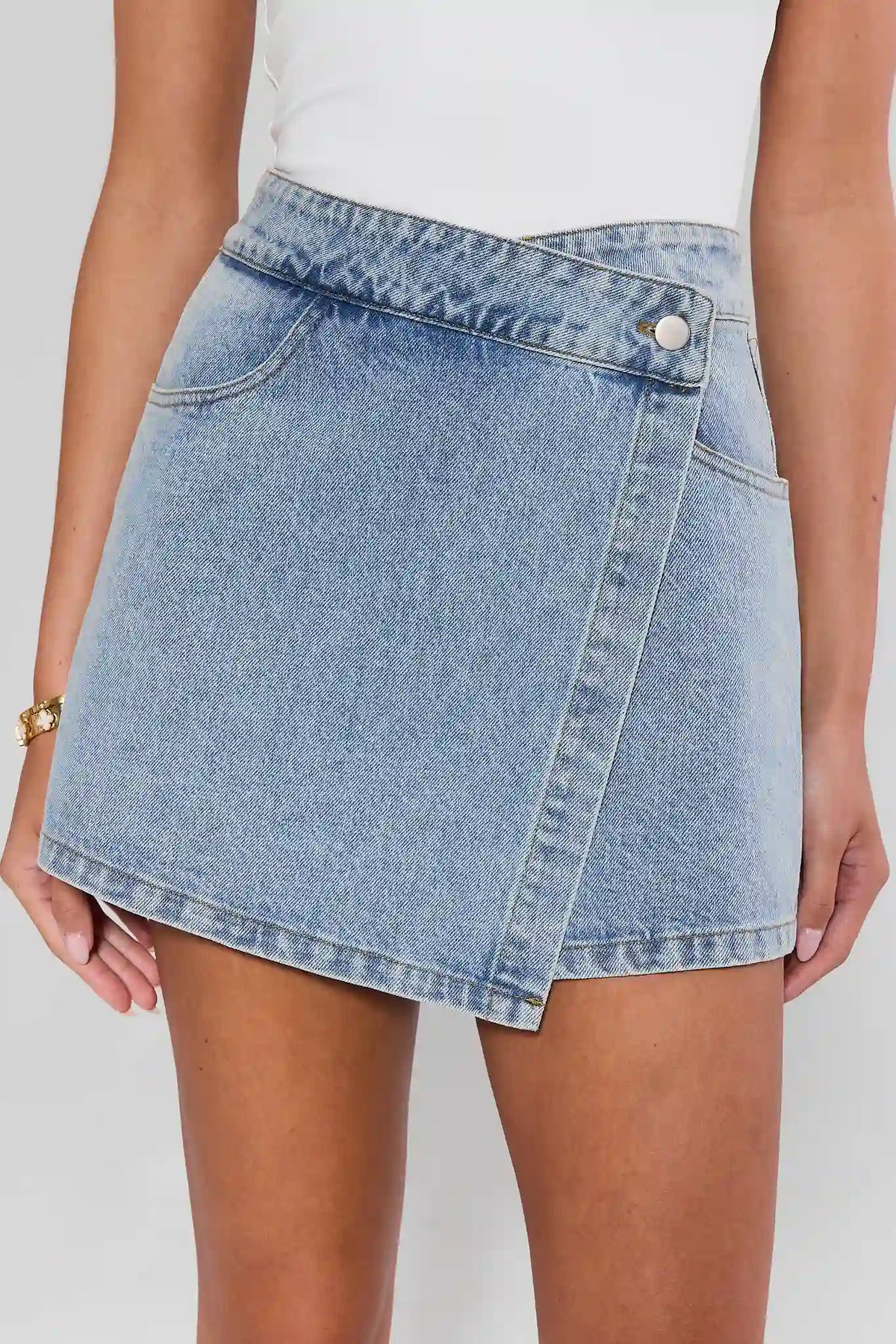 Light Blue Nikki Denim Wrap Skort - Close-Up Front Detail, Crossover Waist & Button | Avara