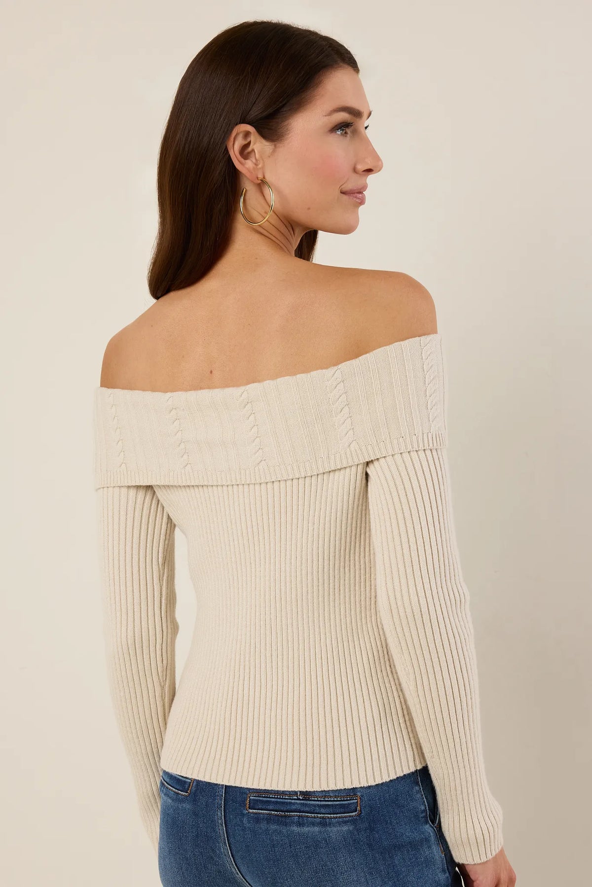 Ashlyn Ribbed Knit Top cream off-shoulder sweater with cable-knit collar, paired with blue jeans - Back View | Avara