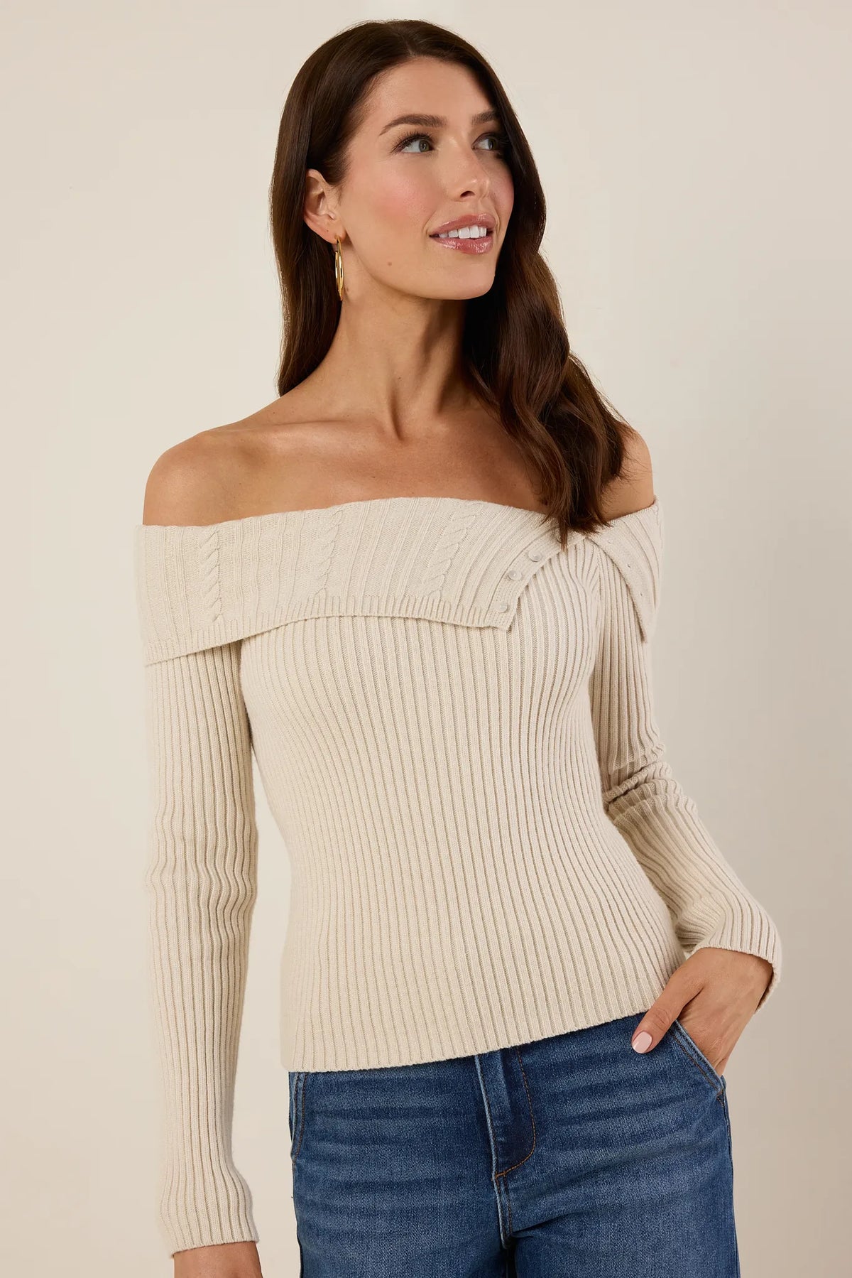 Ashlyn Ribbed Knit Top in cream off-shoulder style with cable-knit trim, styled with blue jeans - Front View | Avara