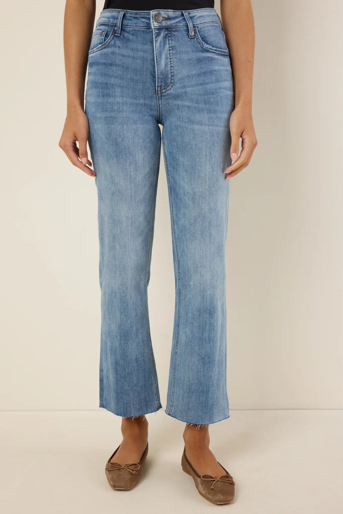 Kelsey Medium Wash Kick Flare Jeans - Front Full-Length View, raw hem and flare leg, tan ballet flats | Avara