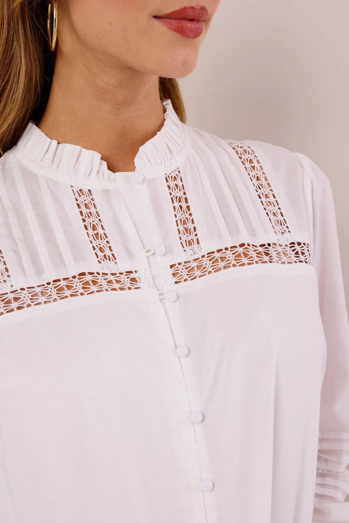 Close-up of Sable White Button Up Top showing crochet lace yoke, pintucked panels, ruffled collar, and fabric-covered buttons - Detail View | Avara