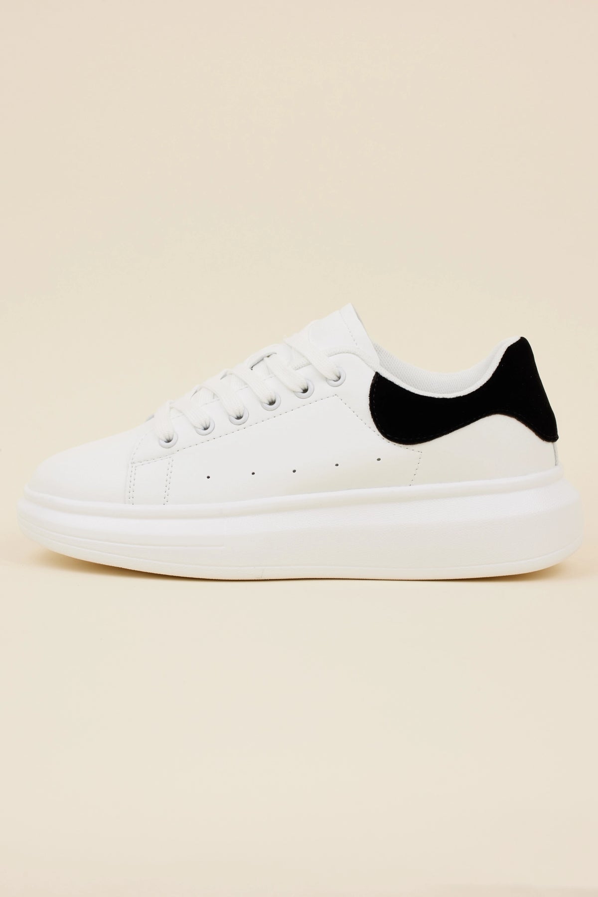 Georgie White Faux Leather Platform Sneakers with chunky sole and black suede heel accent - Side Profile | Avara