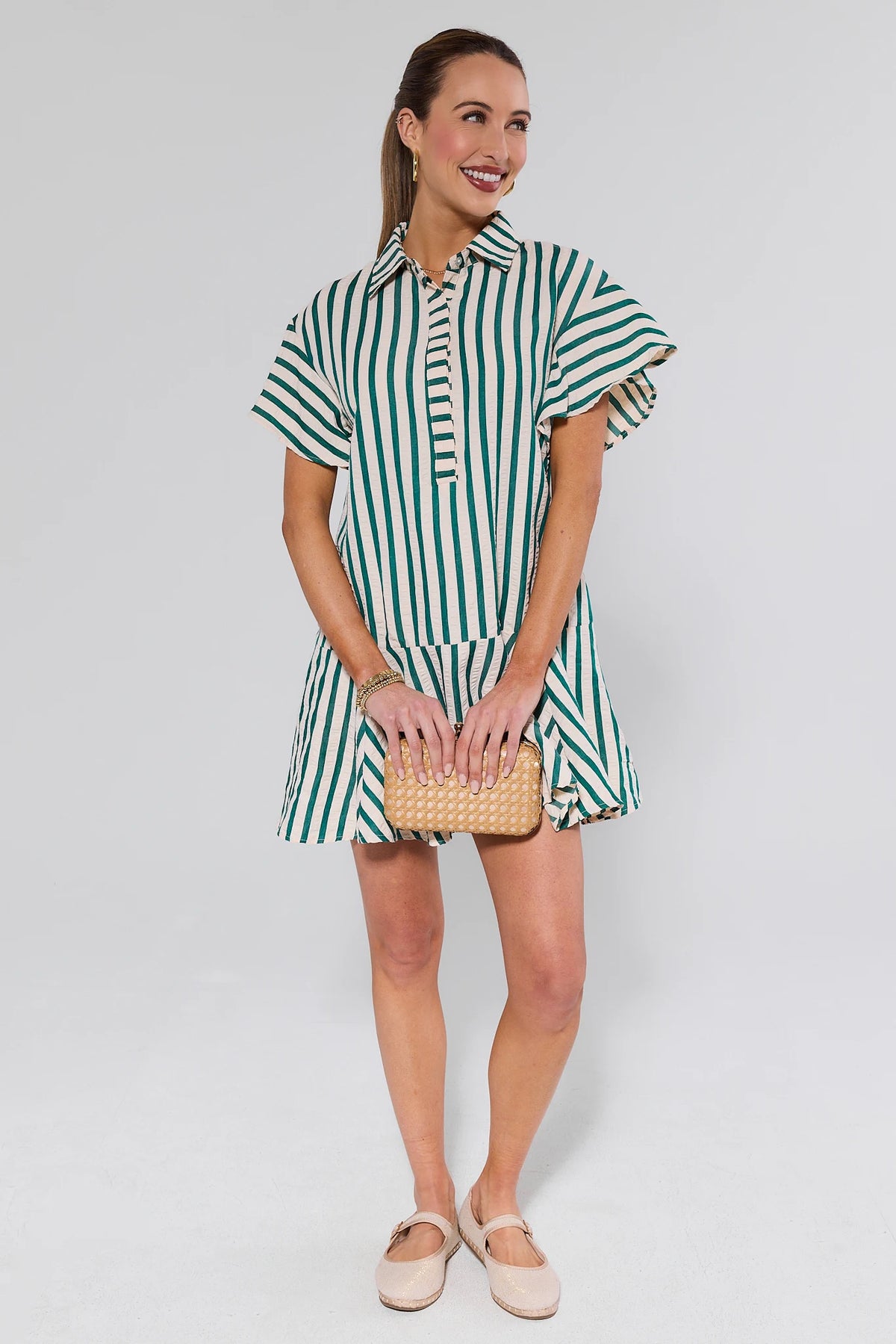 Daniella Green Striped Short Dress styled with loafers and woven clutch - Full Length View | Avara