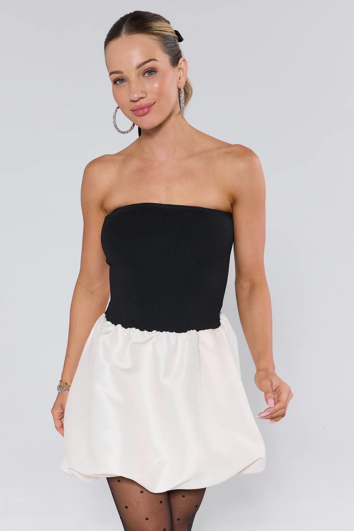 Sasha Strapless Bubble Mini Dress, black ribbed bodice, white bubble skirt, polka-dot tights - Front View | Avara