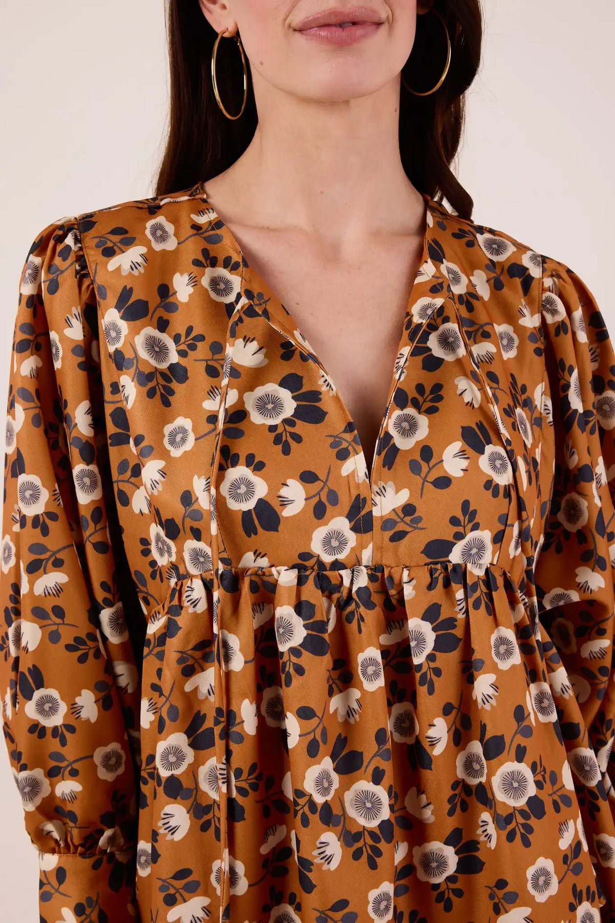 Susie Floral Short Dress - Close-Up Neckline & Empire Waist Detail, gold hoop earrings | Avara