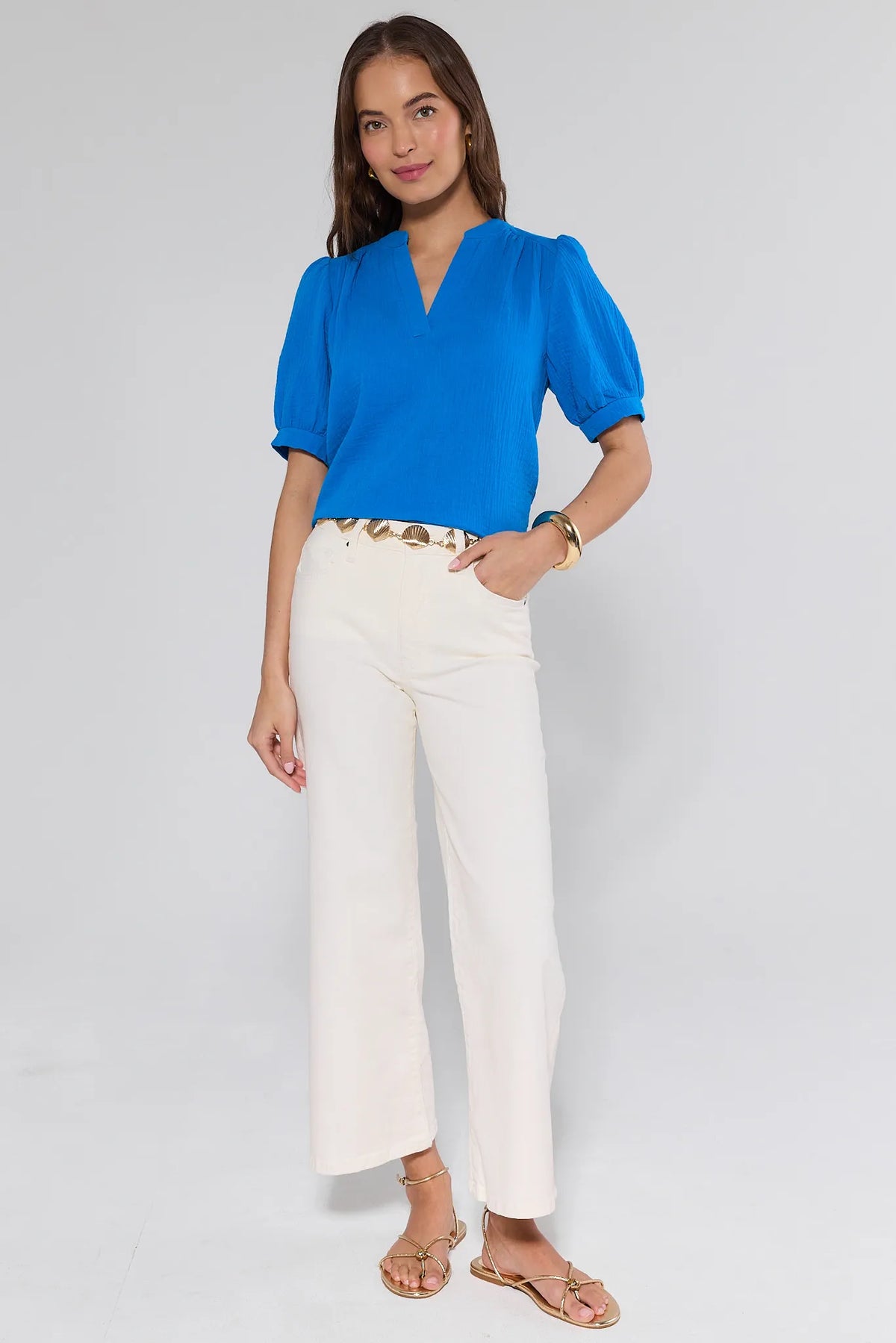 Meg Cream Wide Leg Jeans styled with blue puff-sleeve top and gold sandals - Full Outfit View | Avara
