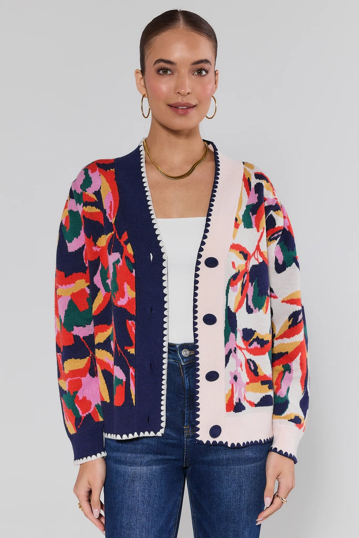 Leslie Navy Floral Cardigan with colorful print, scalloped trim, navy buttons, layered over white tank and dark jeans - Front View | Avara