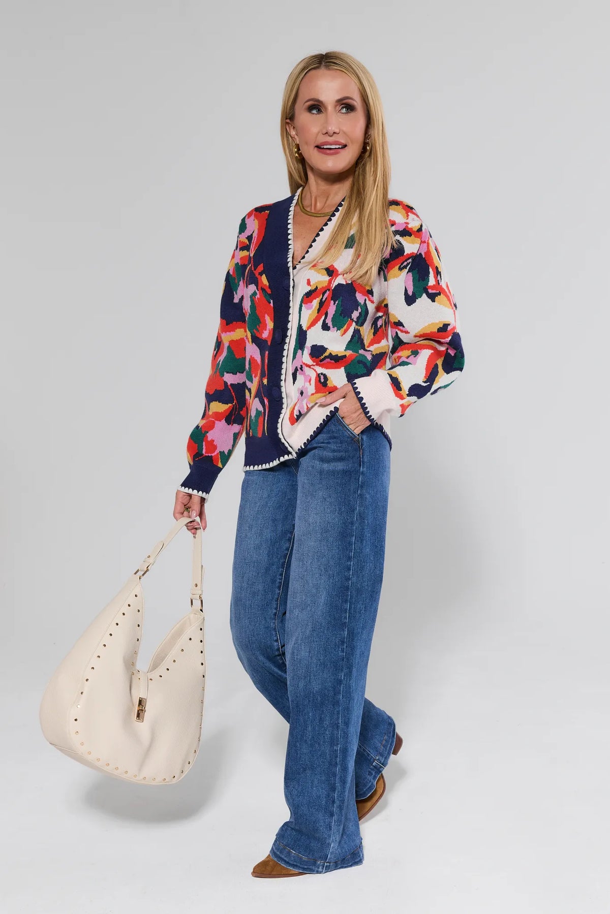 Leslie Navy Floral Cardigan styled with wide-leg jeans and cream studded bag, oversized colorful knit - Full Body Look | Avara