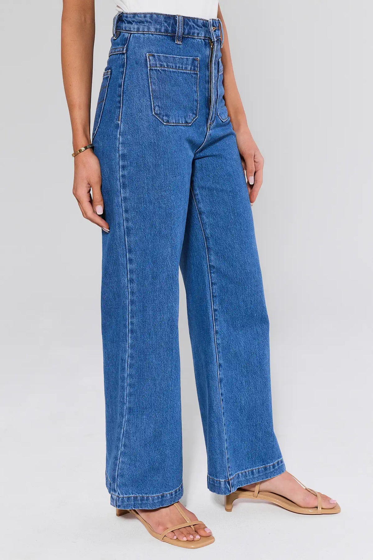 Rolla's Sailor Medium Wash Flare Jeans - Side View, High-Rise Zip Detail | Avara