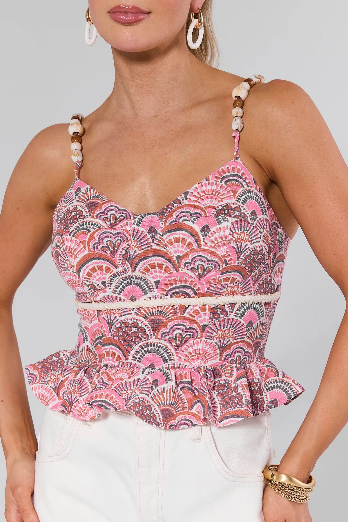 Susie Pink Printed Peplum Top with beaded straps and white pants - Front View, women's pink peplum top | Avara