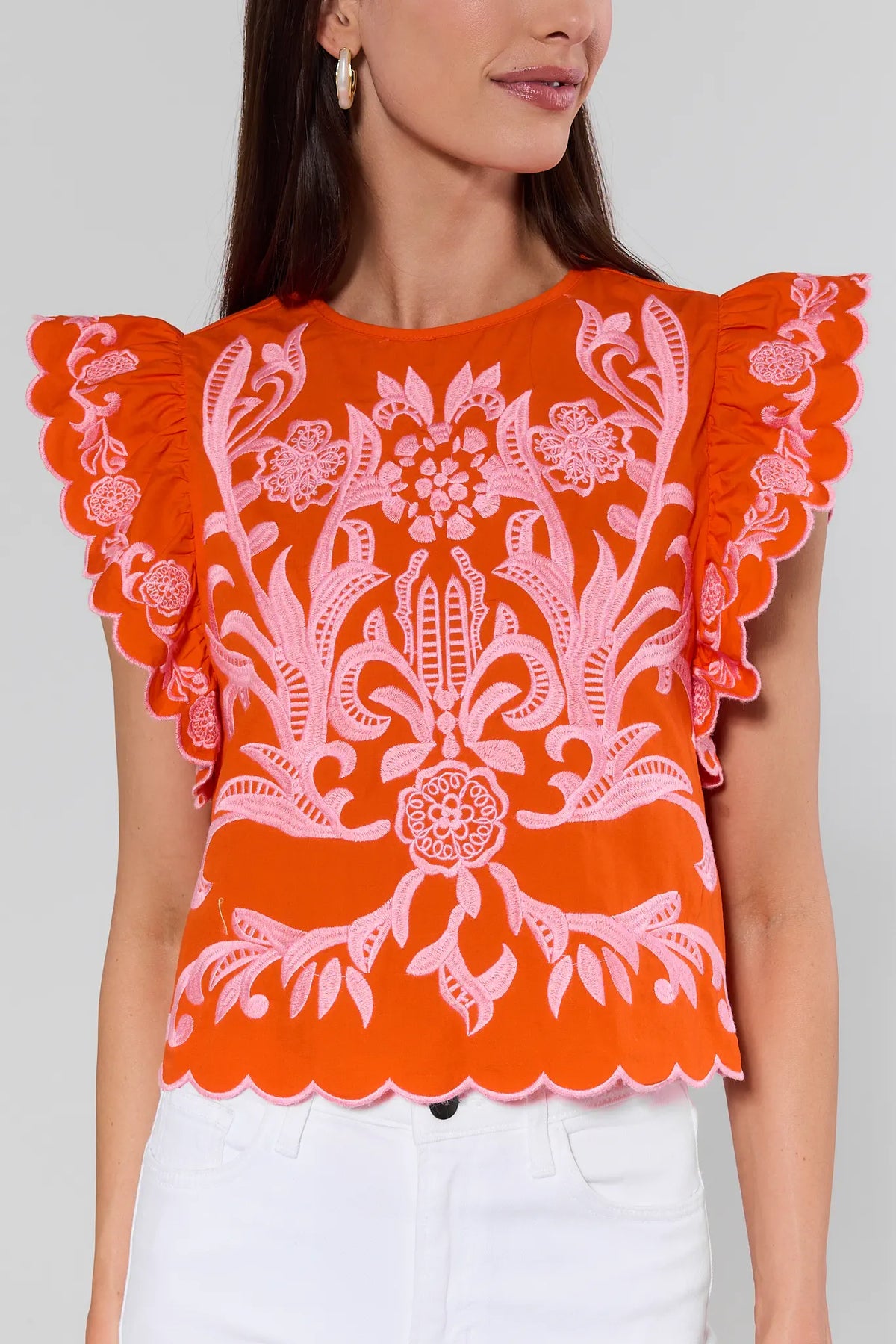 Bradley Orange Embroidered Top by THML with scalloped ruffle sleeves and pink floral detail - Close-Up Front | Avara