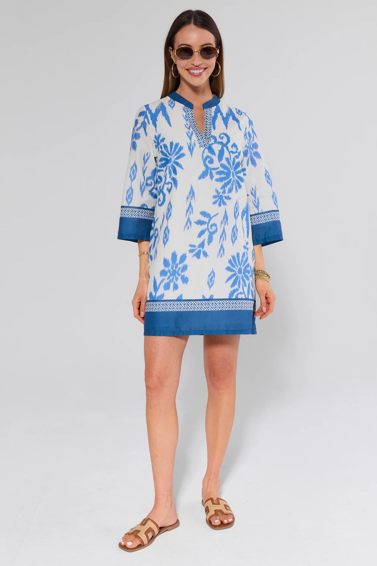 Blue ikat floral tunic dress styled with sandals and sunglasses - Full Length Front View | Avara