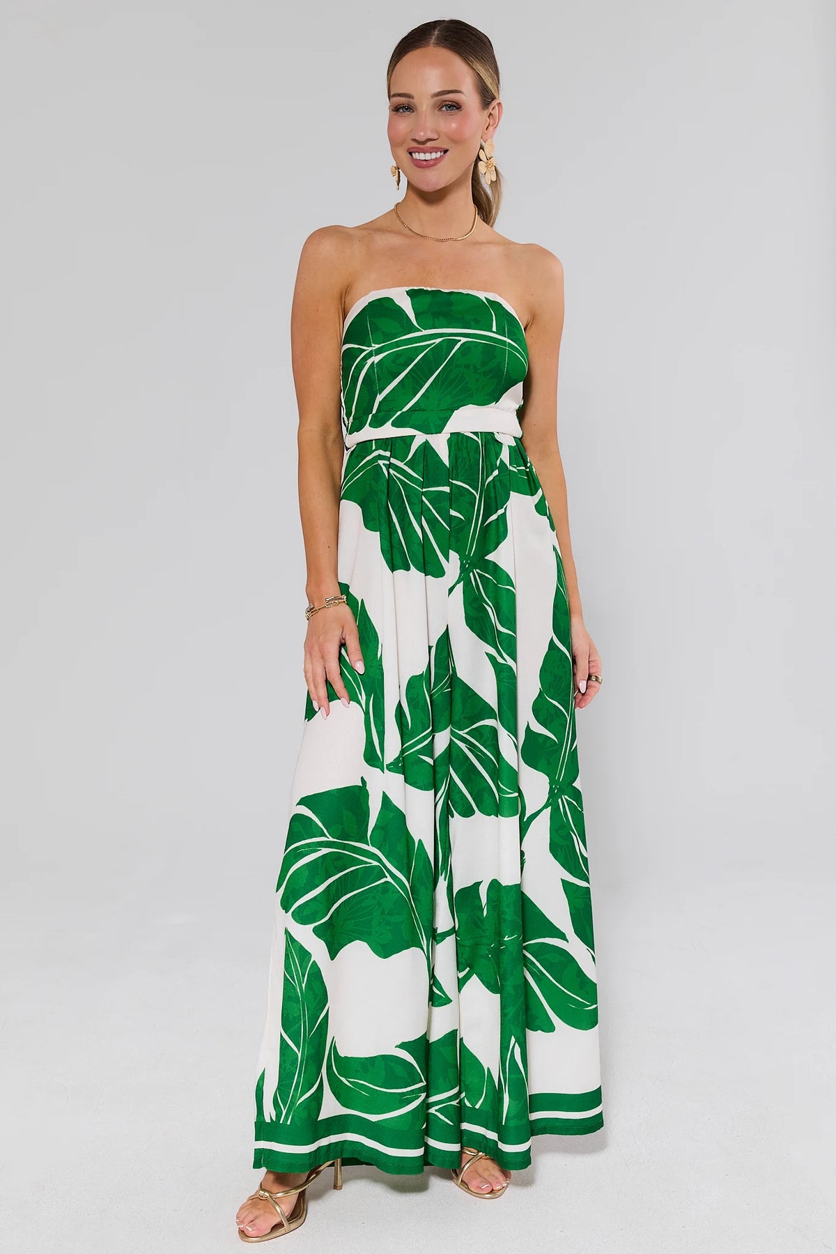 Green palm print strapless wide-leg jumpsuit full length on model - Front View | Avara