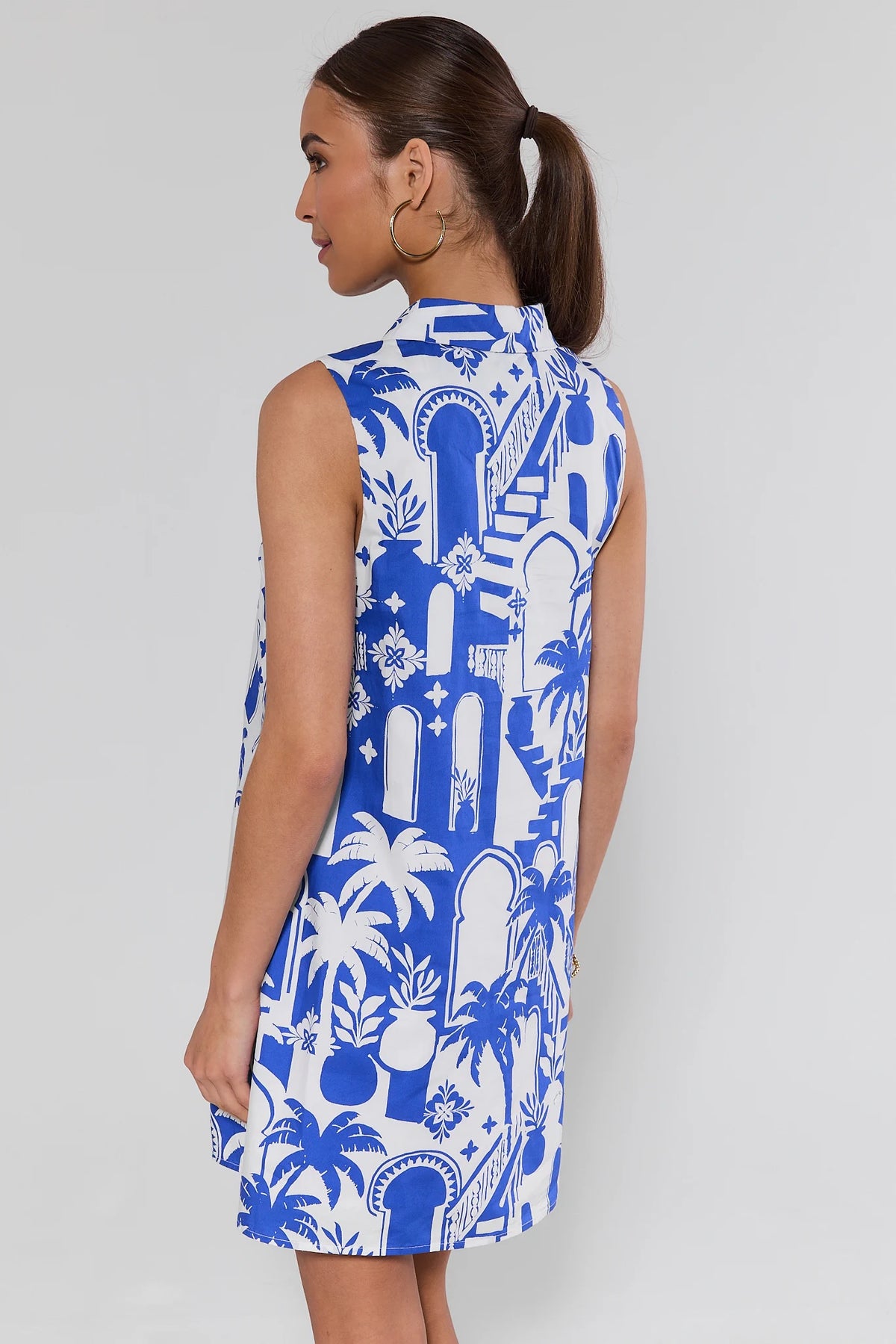 Back view of blue Moroccan print short dress with sleeveless cut and collared neckline | Avara