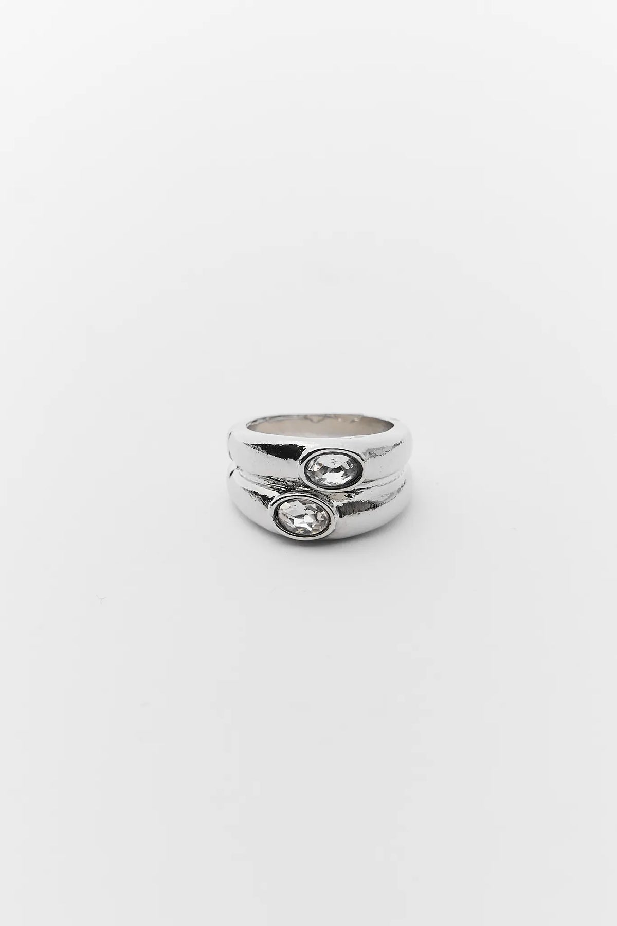Nelly Silver Rhinestone Ring with dual bezel-set crystals, front view on white background | Avara
