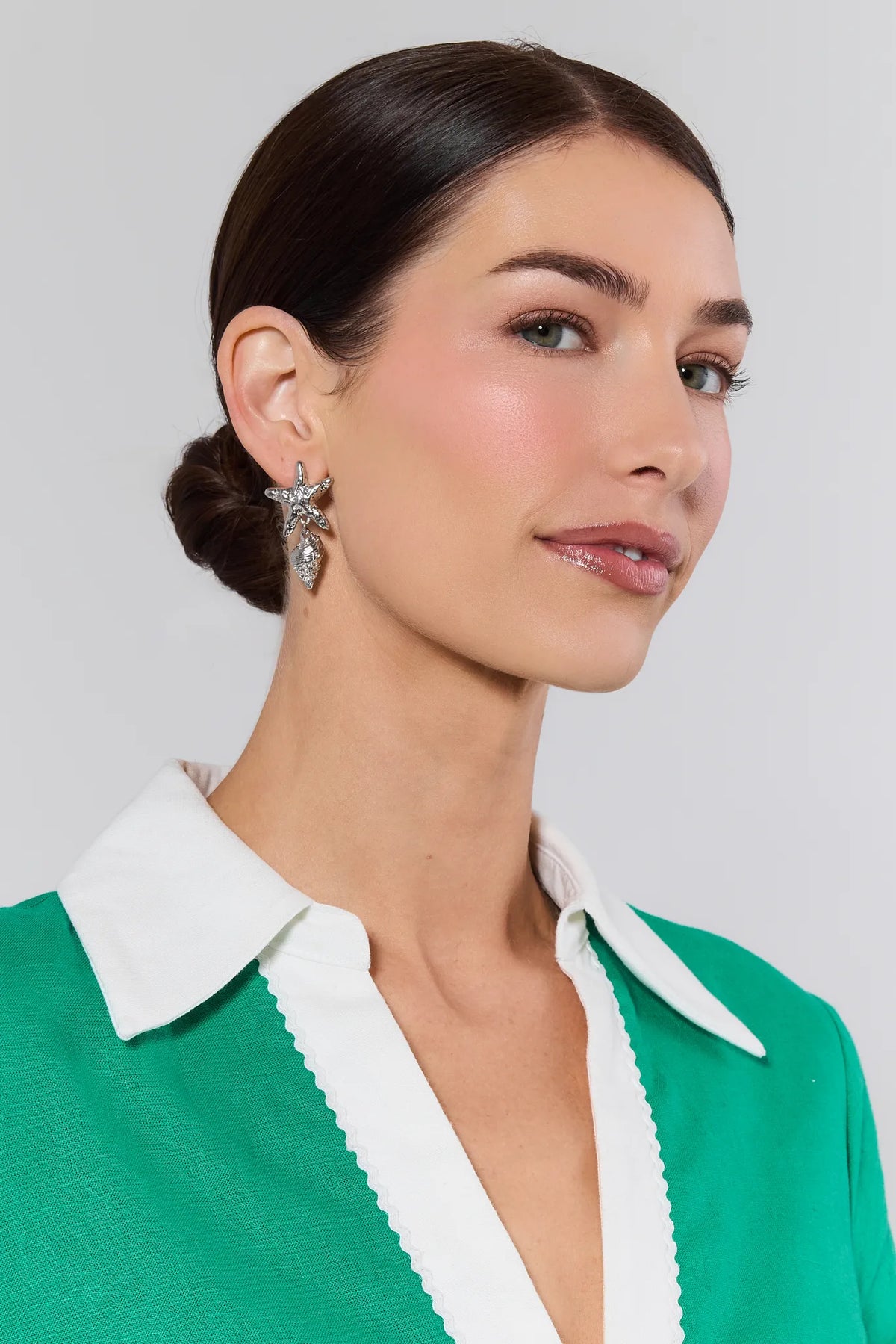Sommer Silver Shell Drop Earrings worn on model in green top - side profile detail | Avara