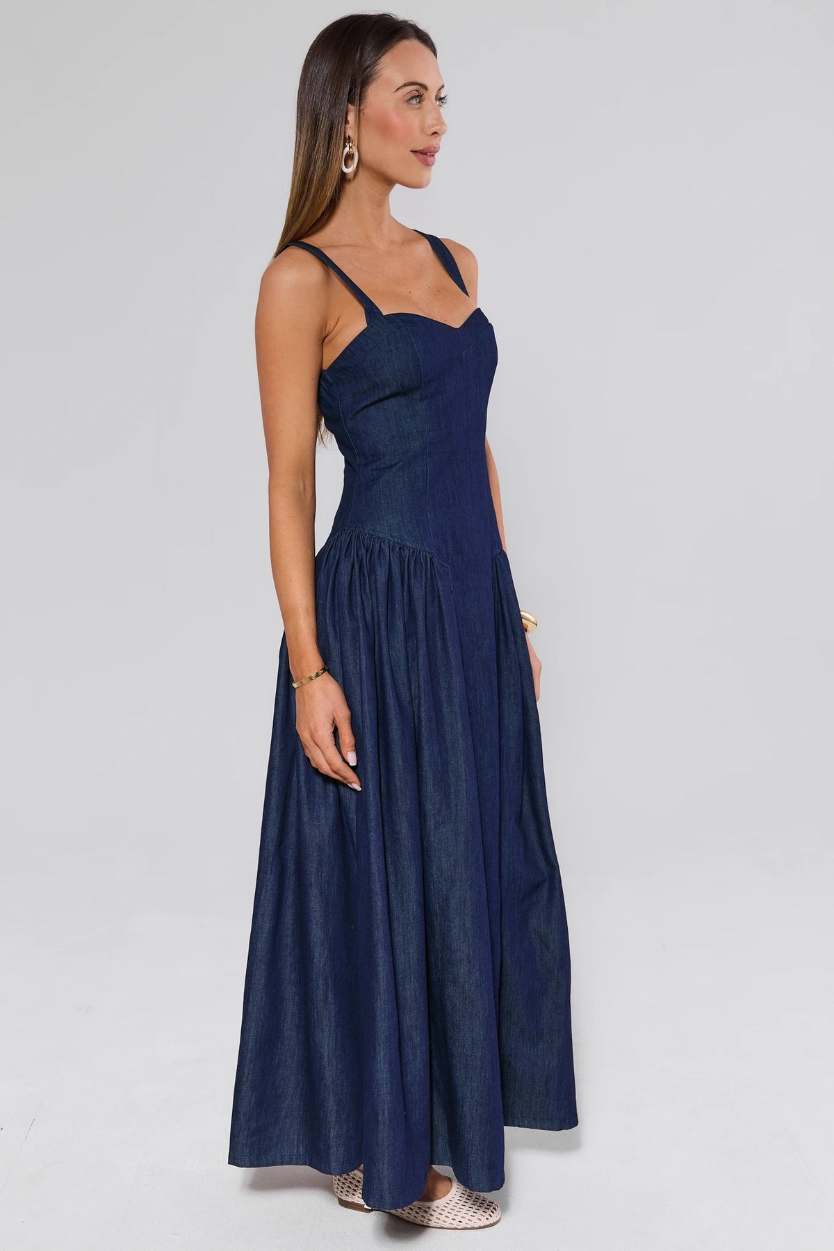 Navy long denim dress for women - Side View, A-line gathered skirt and adjustable straps | Avara
