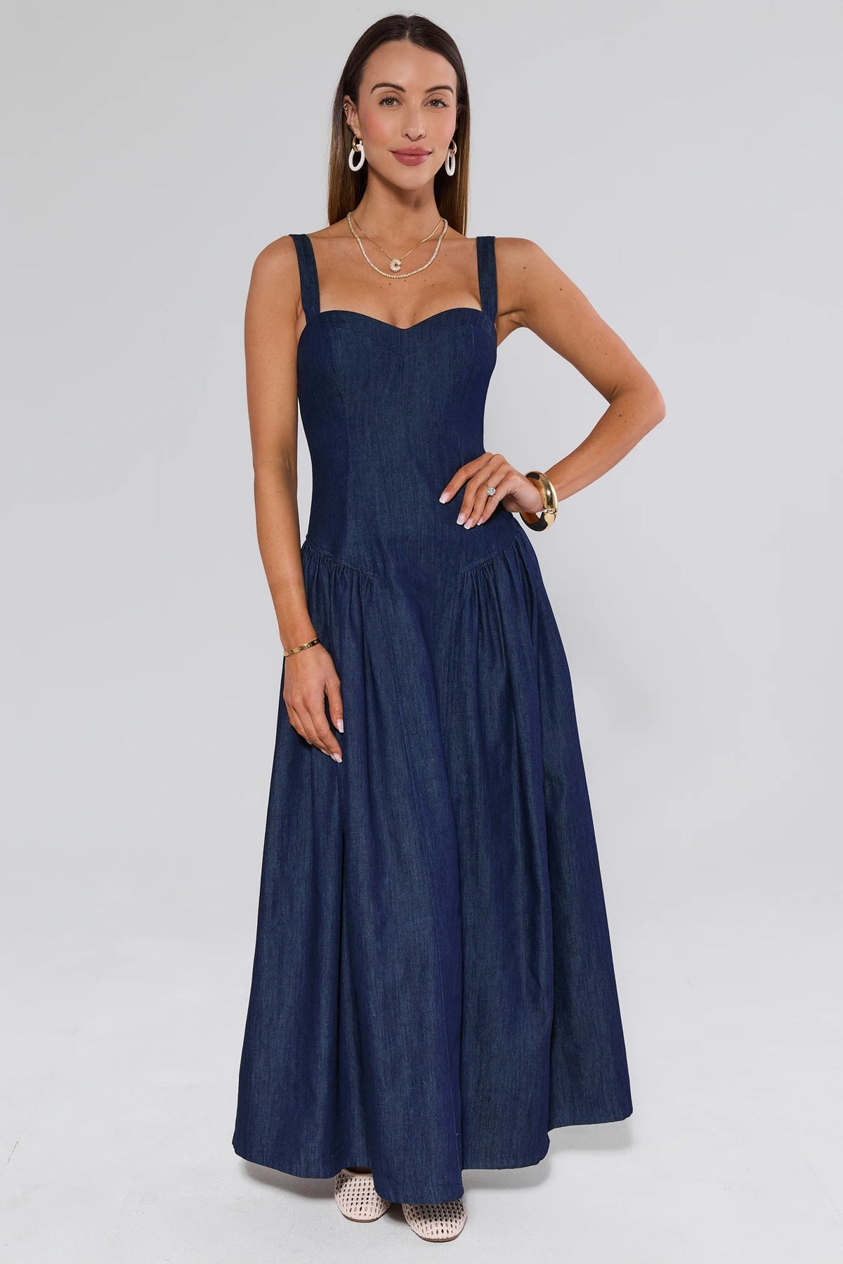 Navy women's denim maxi dress with drop waist - Full Front View, floor-length flowy skirt | Avara