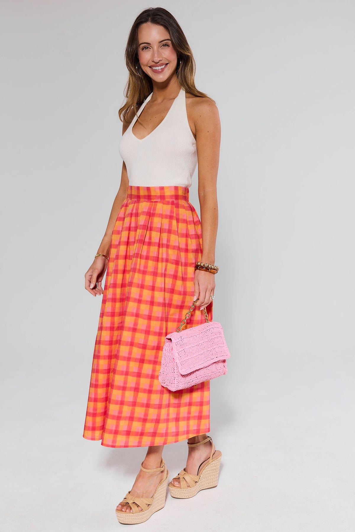 Estie Orange Plaid Midi Skirt styled with white halter top and pink crochet bag - Full Look | Avara
