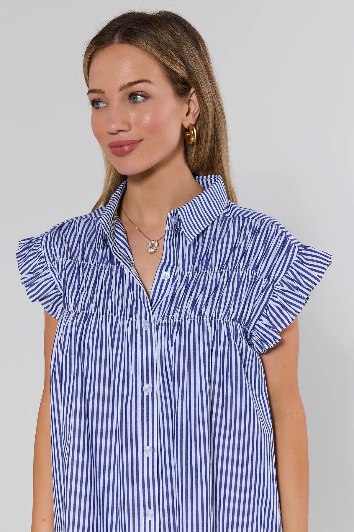 Navy stripe dress ruffle sleeve and collar close-up detail - On Model | Avara