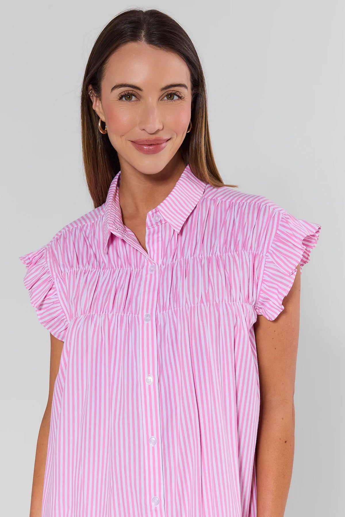 Neacie Pink Striped Short Dress close-up showing smocked bodice, ruffle cap sleeves, and button front | Avara