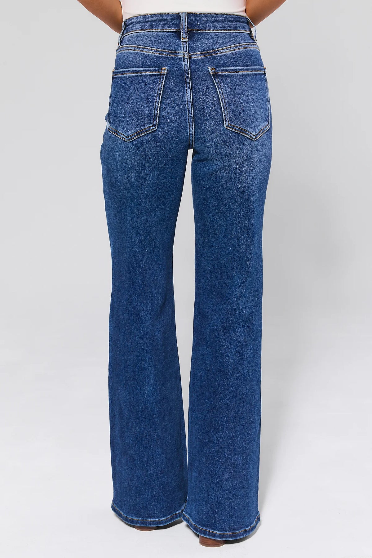 Linda Dark Wash Flare Jeans Back Pocket Detail - Back View On Model | Avara