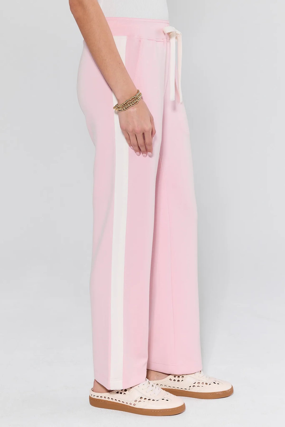 Katelyn Pink Stripe Lounge Pants with cream side stripe and drawstring waist - Side Detail On Model | Avara