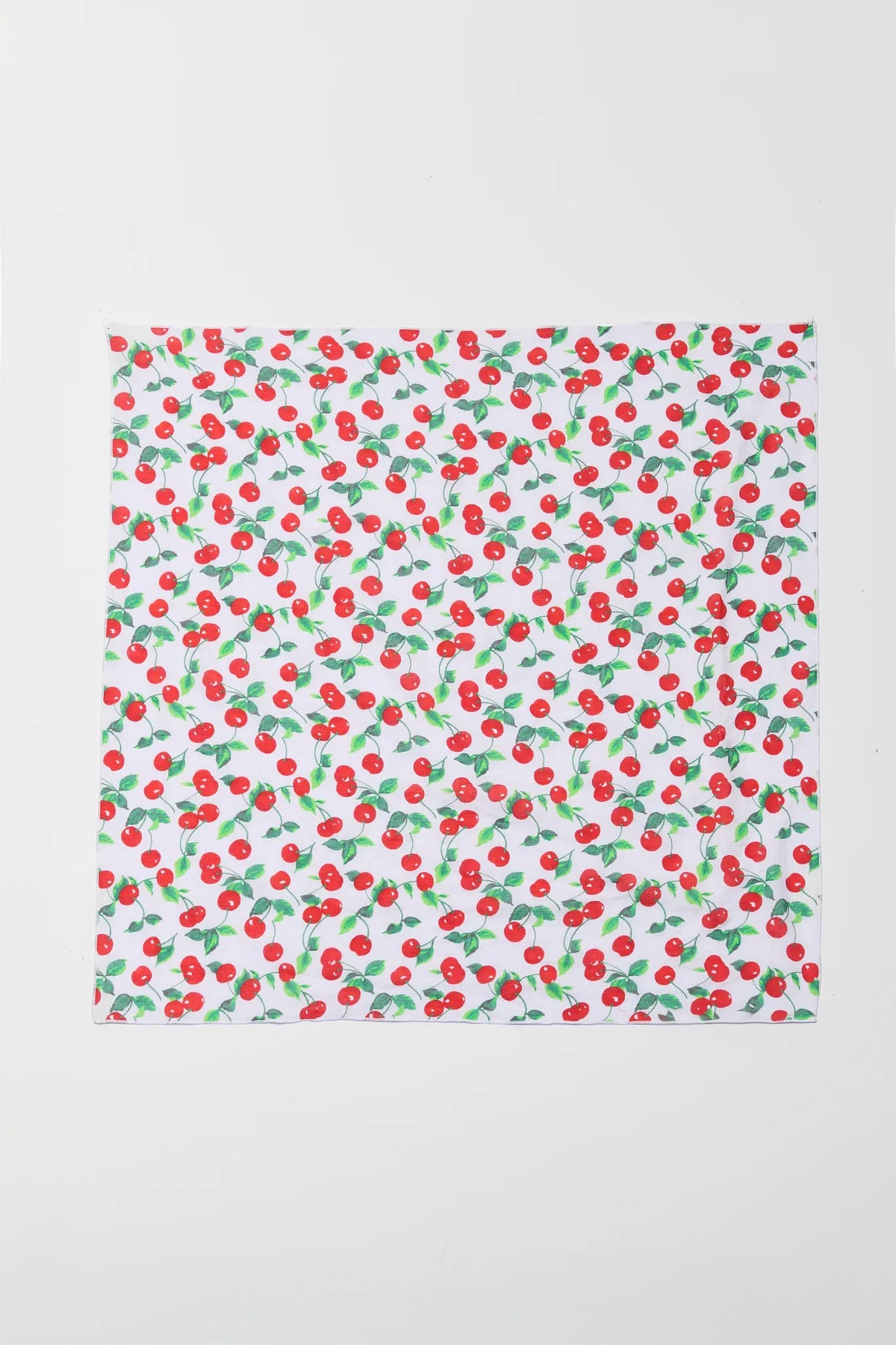 Fabric with cherry pattern on a white background