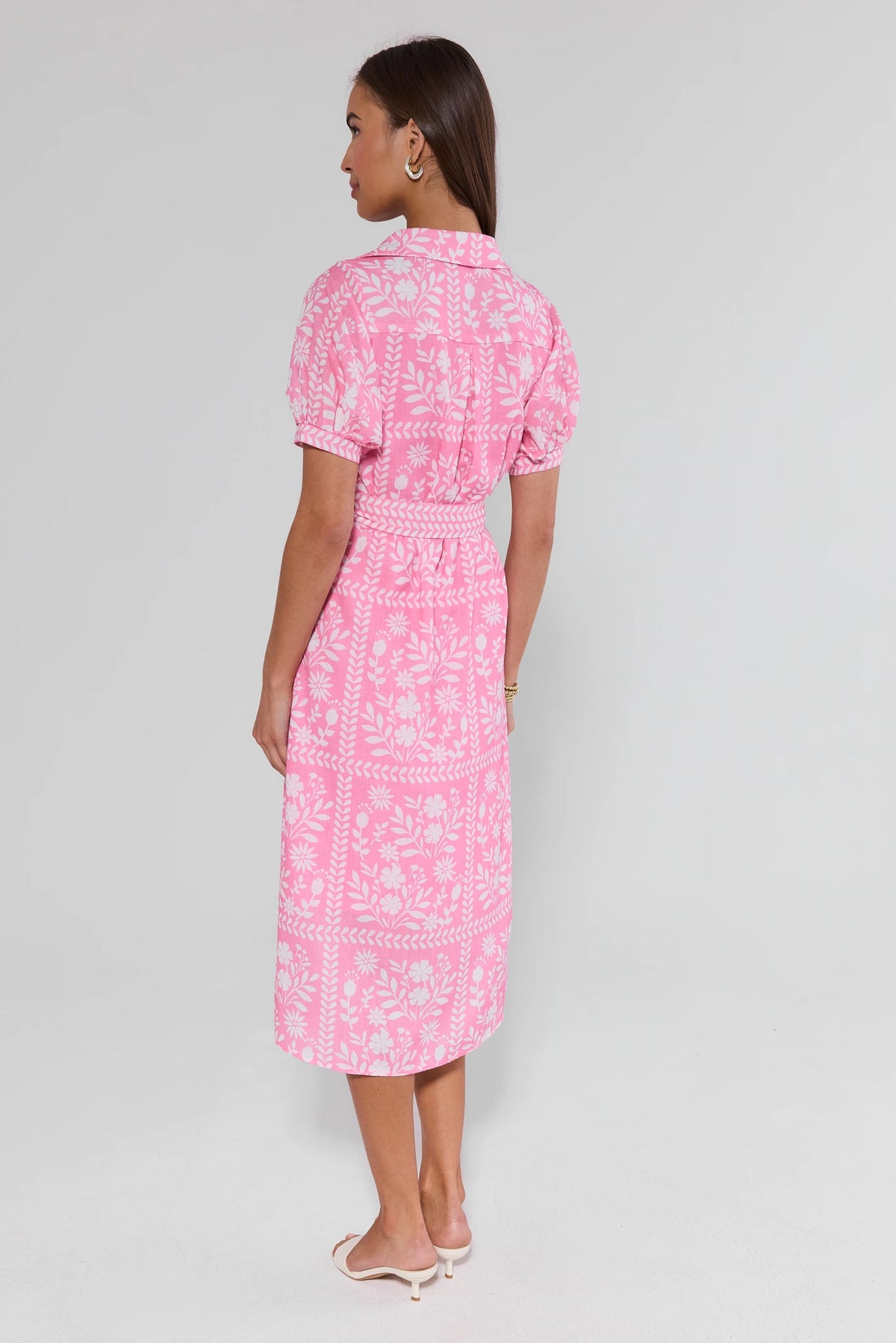 Pink floral print Magnolia midi dress back view showing puff sleeves and midi length coverage | Avara