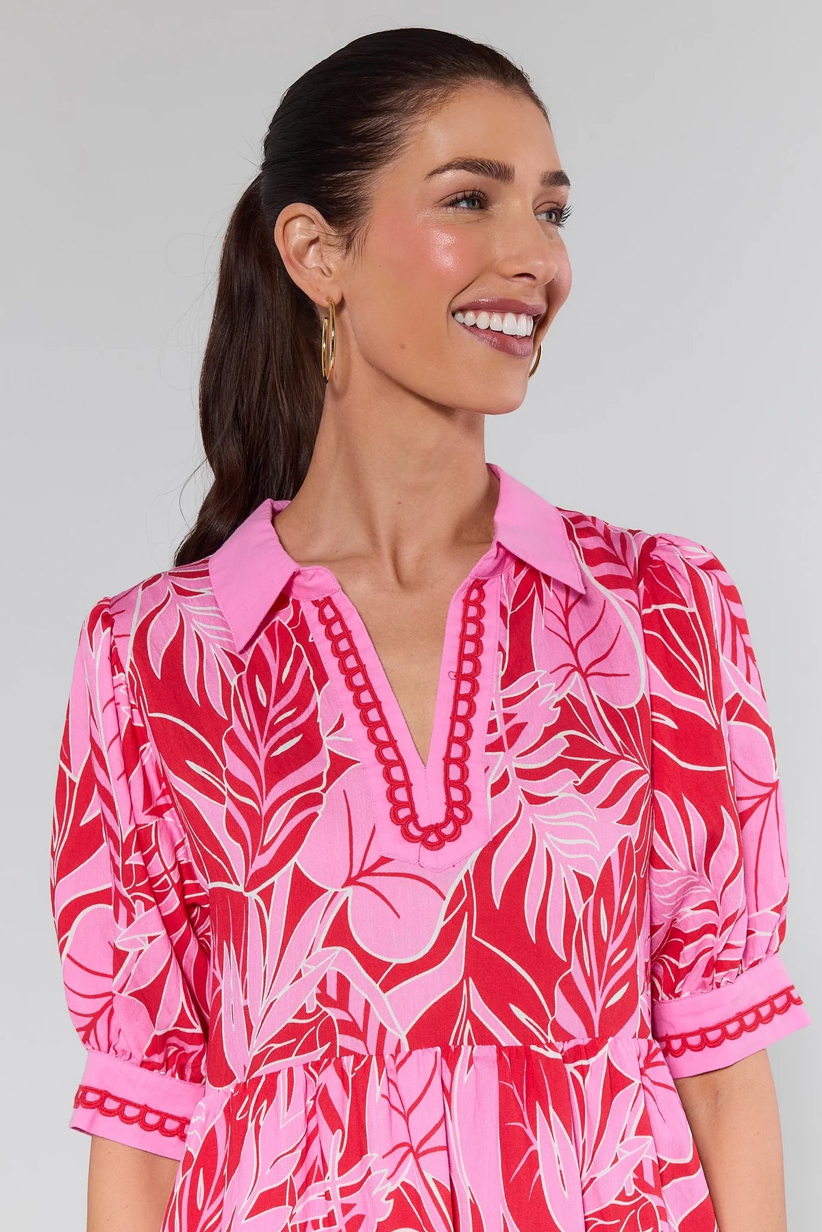 Gale Pink Printed Midi Dress close-up showing pink collar, scalloped V-neckline trim, and puff sleeves - Neckline Detail | Avara