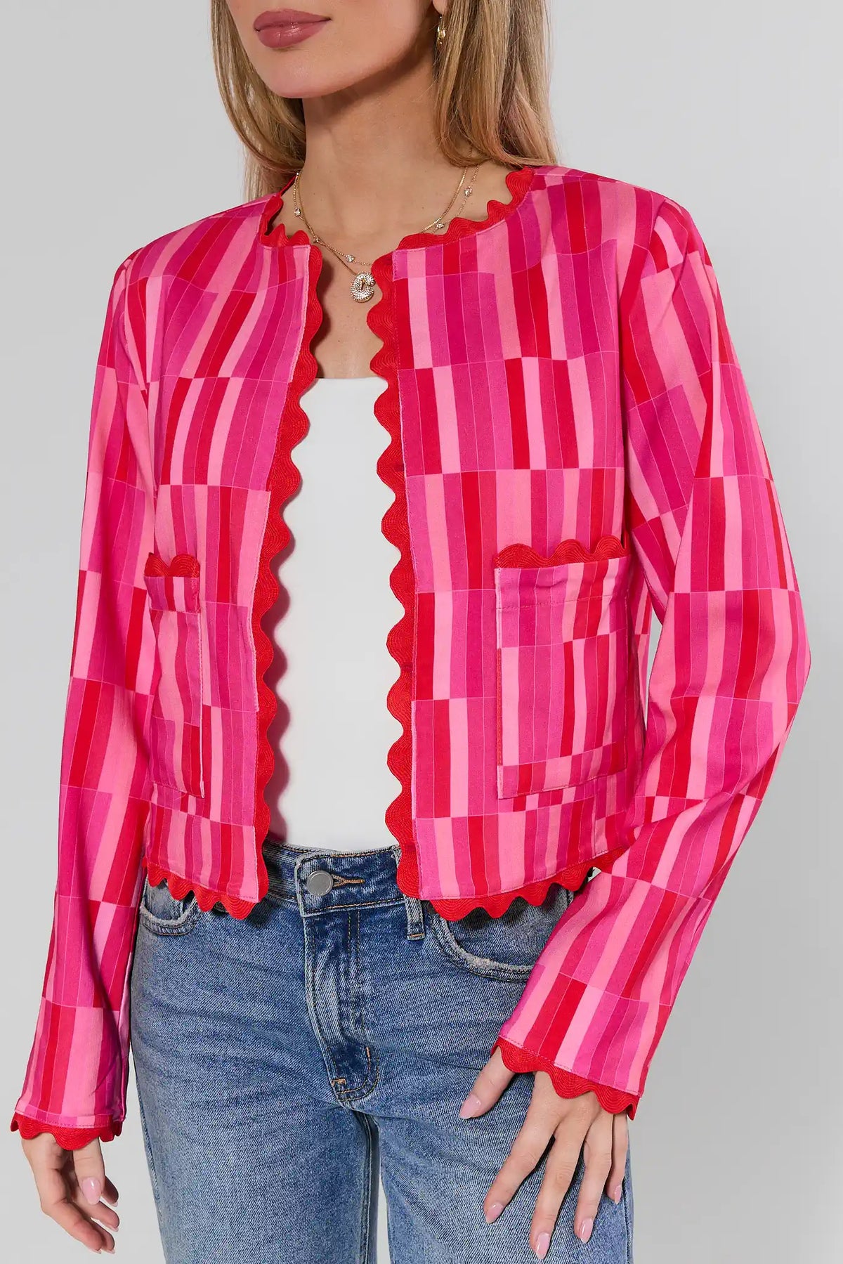 Jesse Pink Printed Scalloped Jacket with red trim detail over white tank and blue jeans - Close-Up Front | Avara