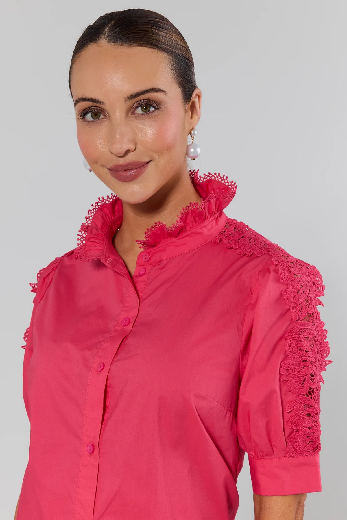 Maribeth Pink Lace Button Up Top close-up showing floral lace sleeve and ruffle collar detail | Avara