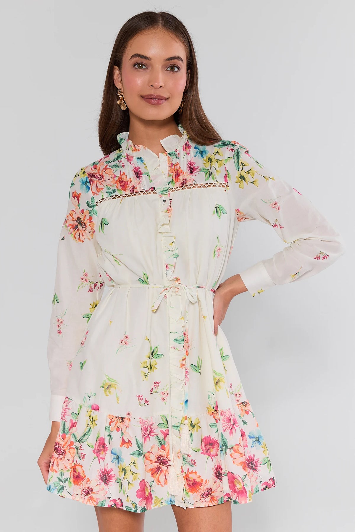 Woman wearing a floral dress with a plain background