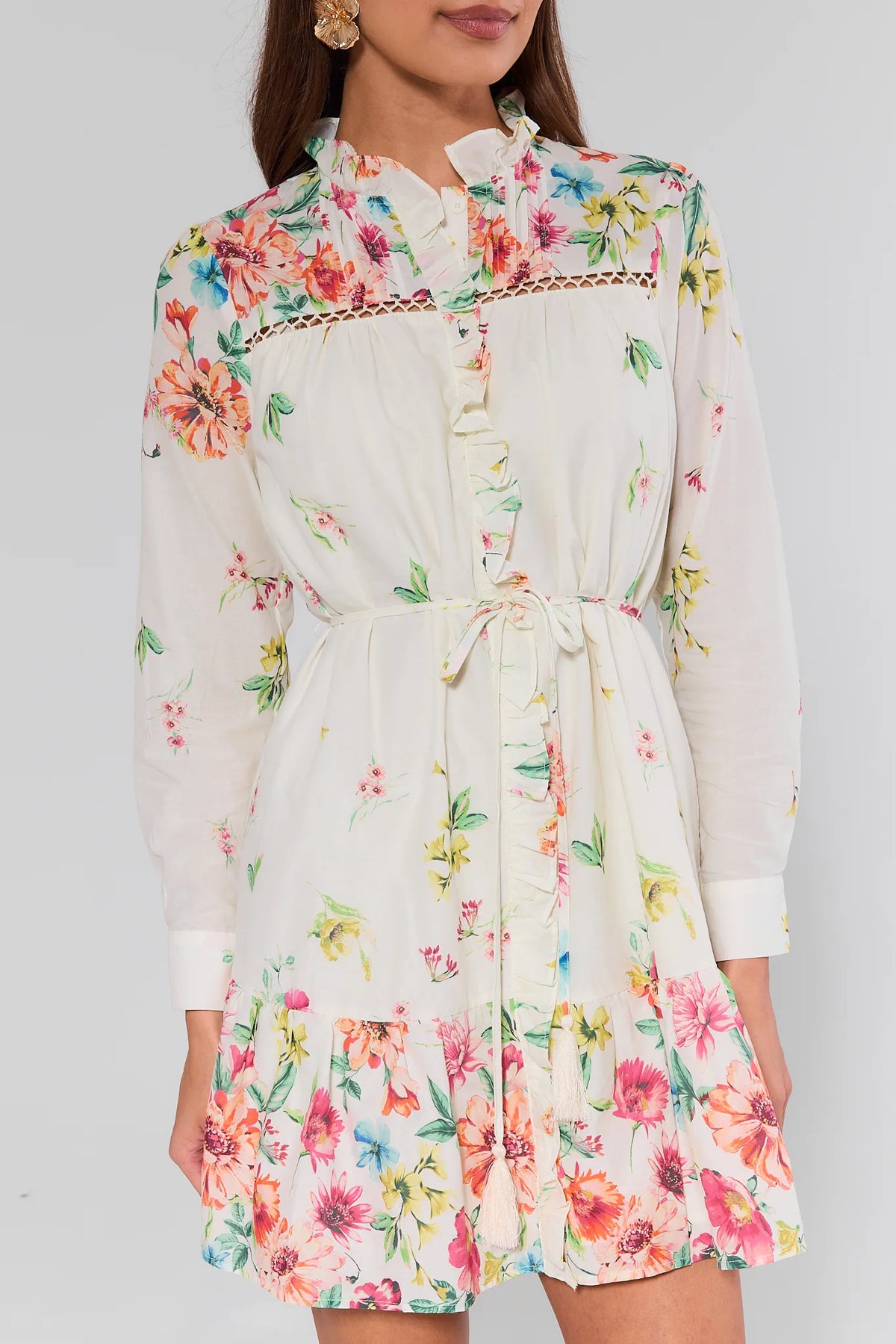 Floral dress with long sleeves on a plain background