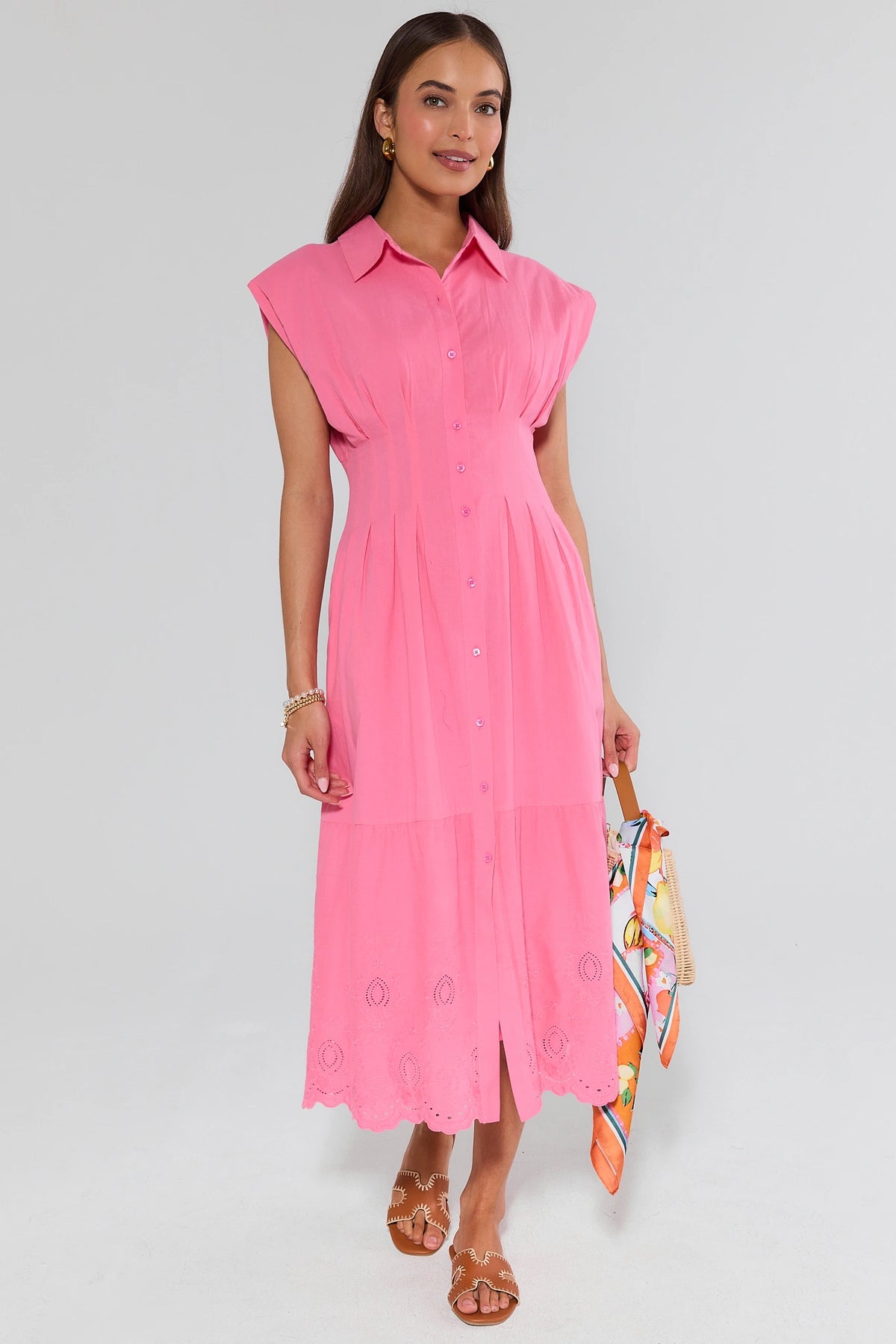 Pink modest maxi dress full-length front view styled with sandals and colorful bag | Avara