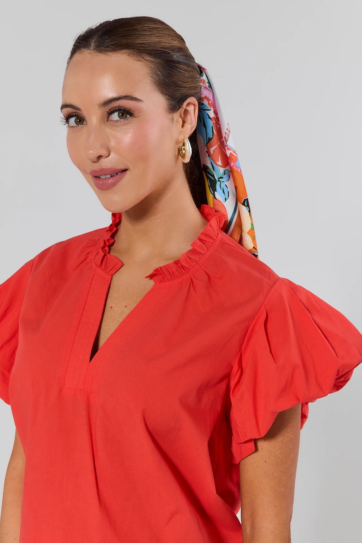 Agnes Orange Split Neck Top ruffle collar and flutter sleeve close-up detail, cute top for women | Avara