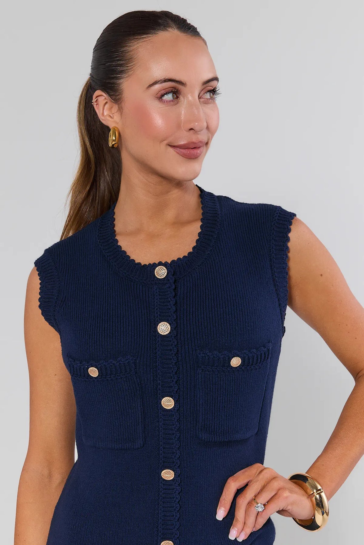 Navy knit mini dress with scalloped neckline and gold button detail - Close-Up Front | Avara