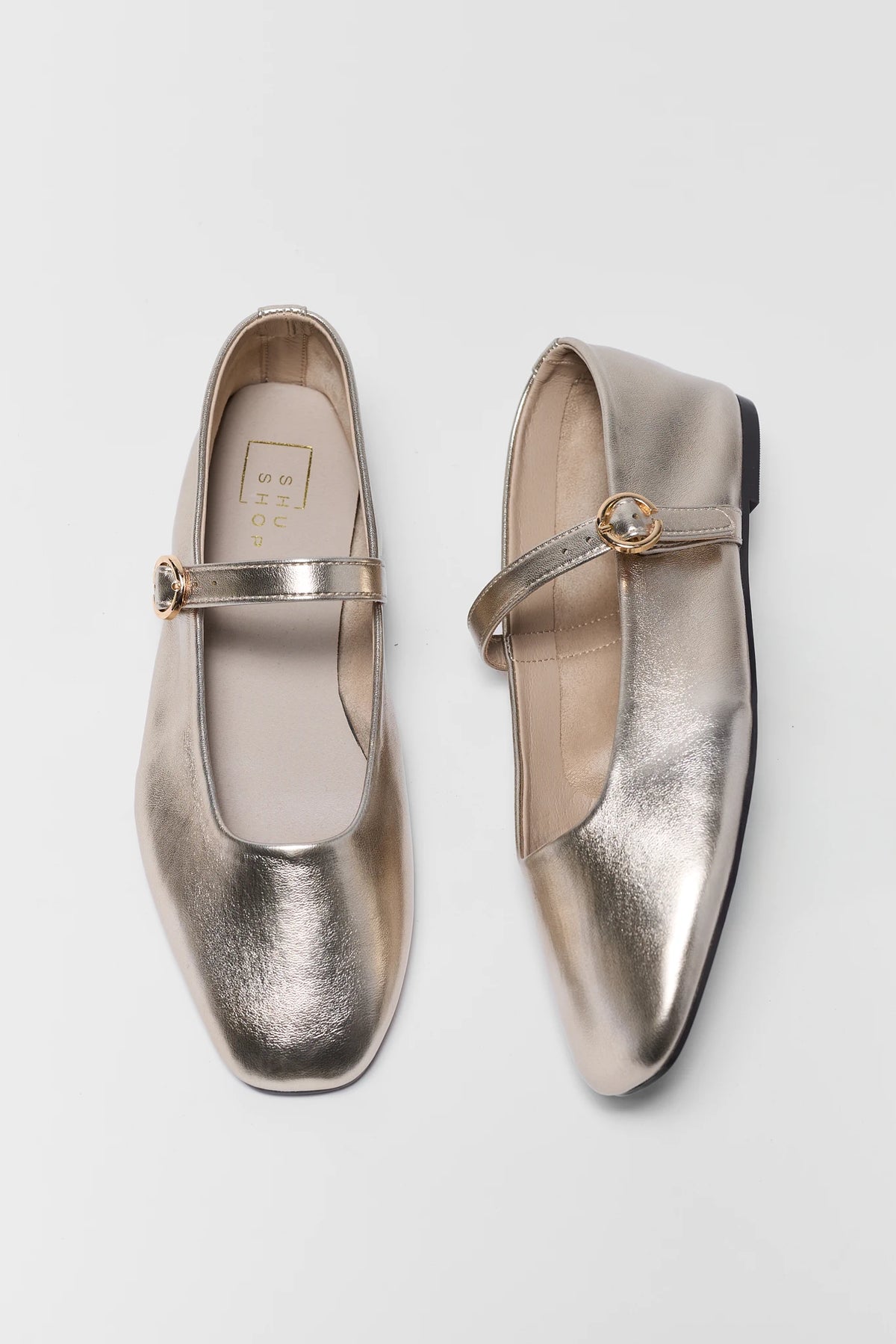 Gold metallic ballet flats with adjustable strap - Top-Down Pair View | Avara