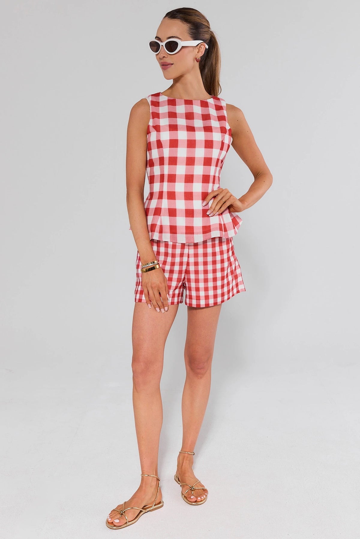 Red gingham matching set top and shorts full-length styled look with gold sandals | Avara