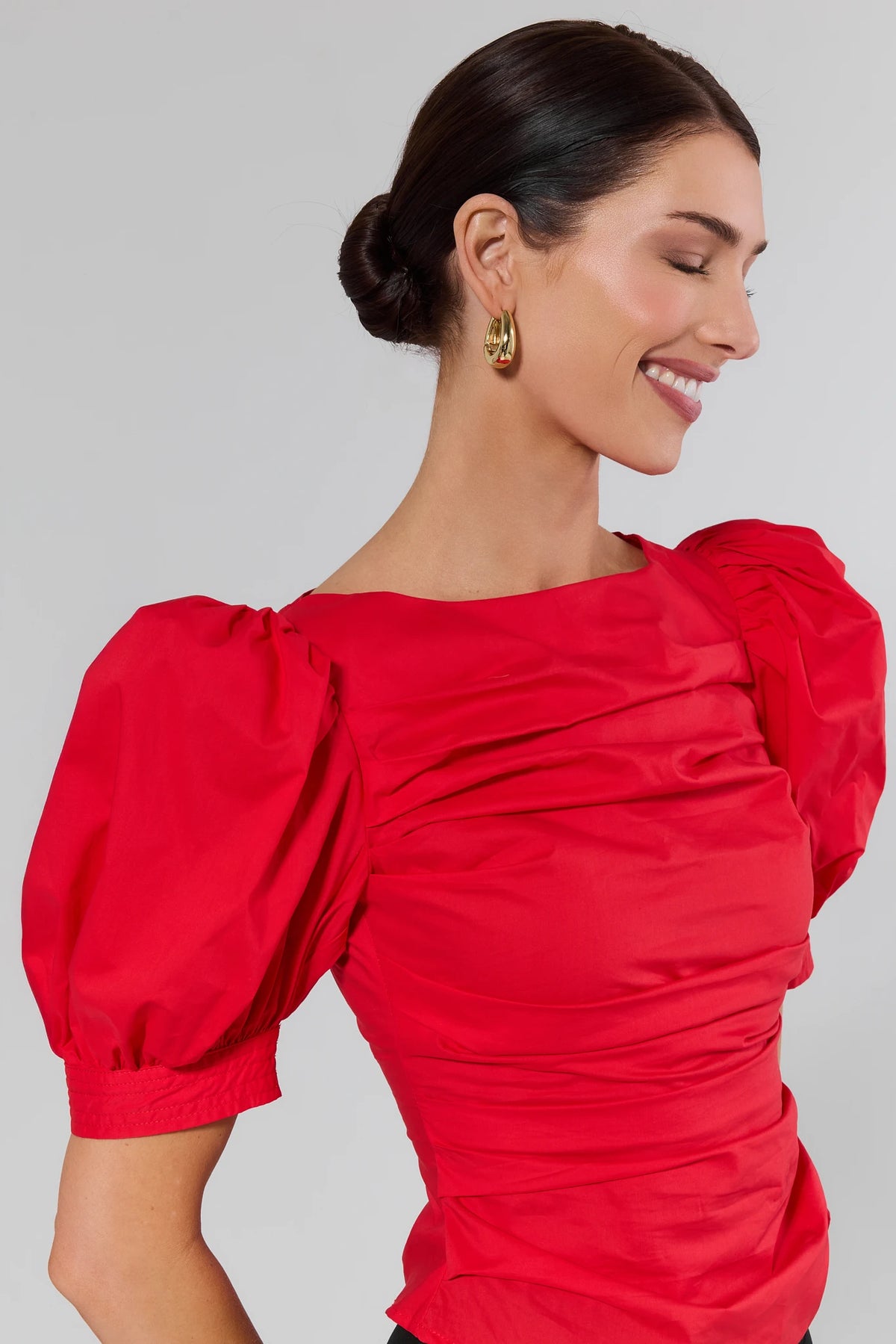 Milly Red Puff Sleeve Blouse gathered bodice detail - Side Angle On Model | Avara