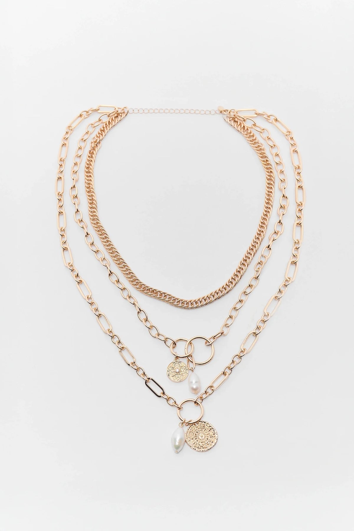 Gold Layered Necklace with coin pendants and pearl charms, chain-link set flat lay | Avara
