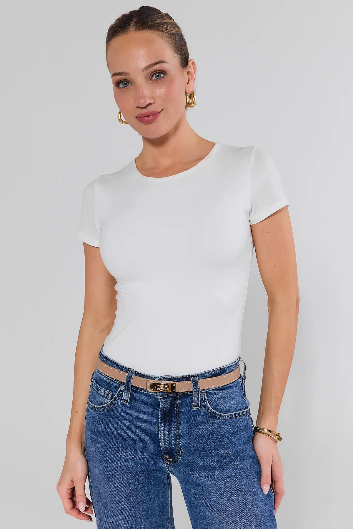 Woman Styled in Tan Faux Leather Piper Belt with White Tee and Blue Jeans - On Model | Avara