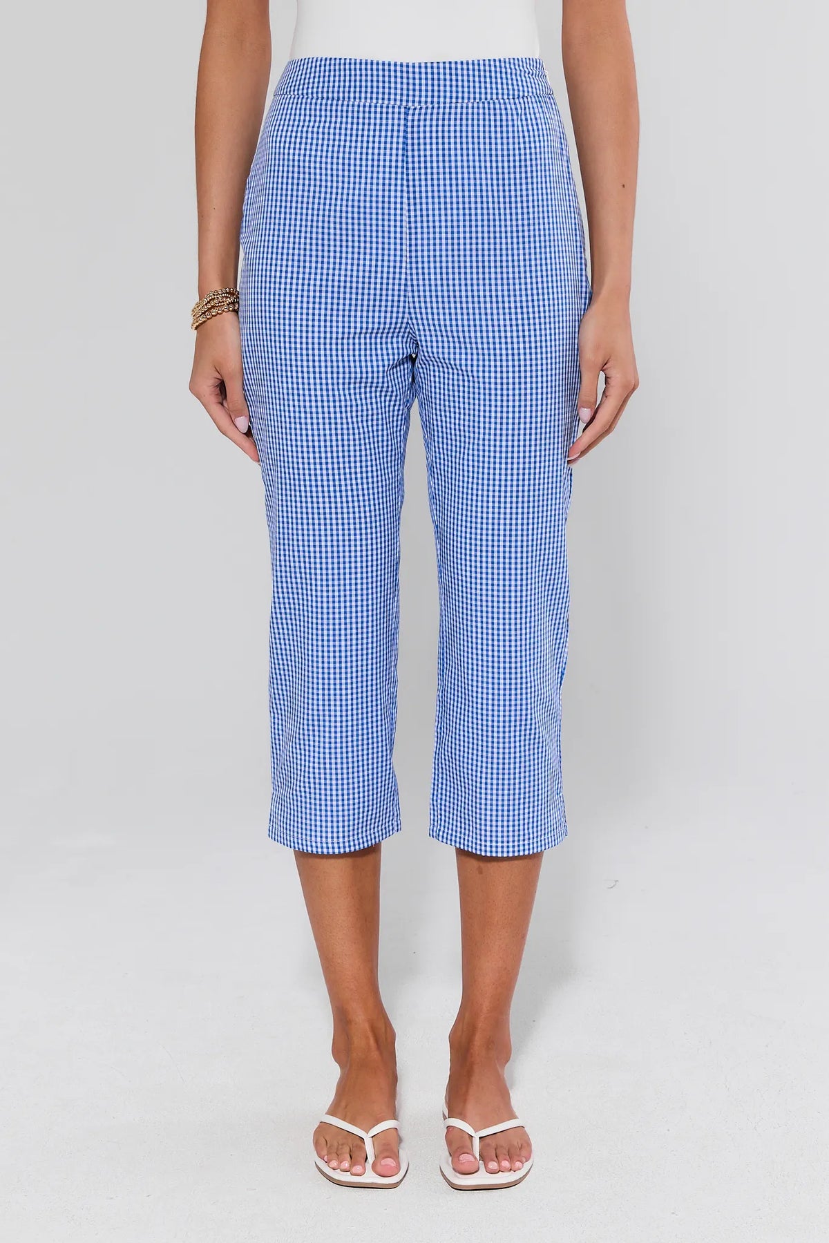 Blue gingham capri pants on model, front view with white tank and flip flops | Avara