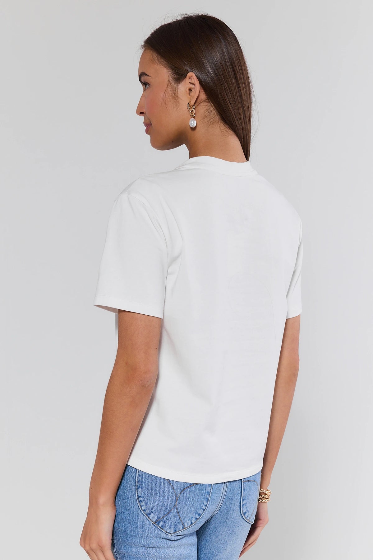 Montauk White Embroidered Tee relaxed silhouette with clean back, paired with blue jeans - Back View | Avara