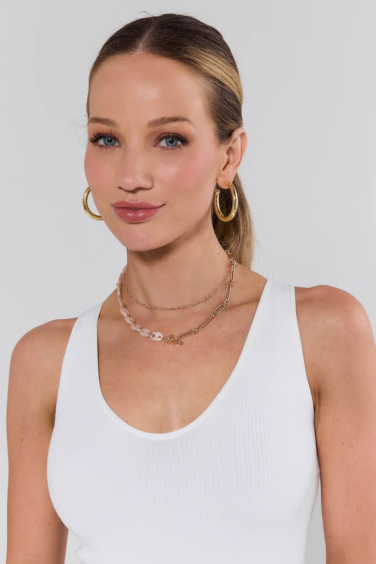 Marley Gold Layered Chain Link Necklace styled on model with gold hoop earrings - On Model | Avara