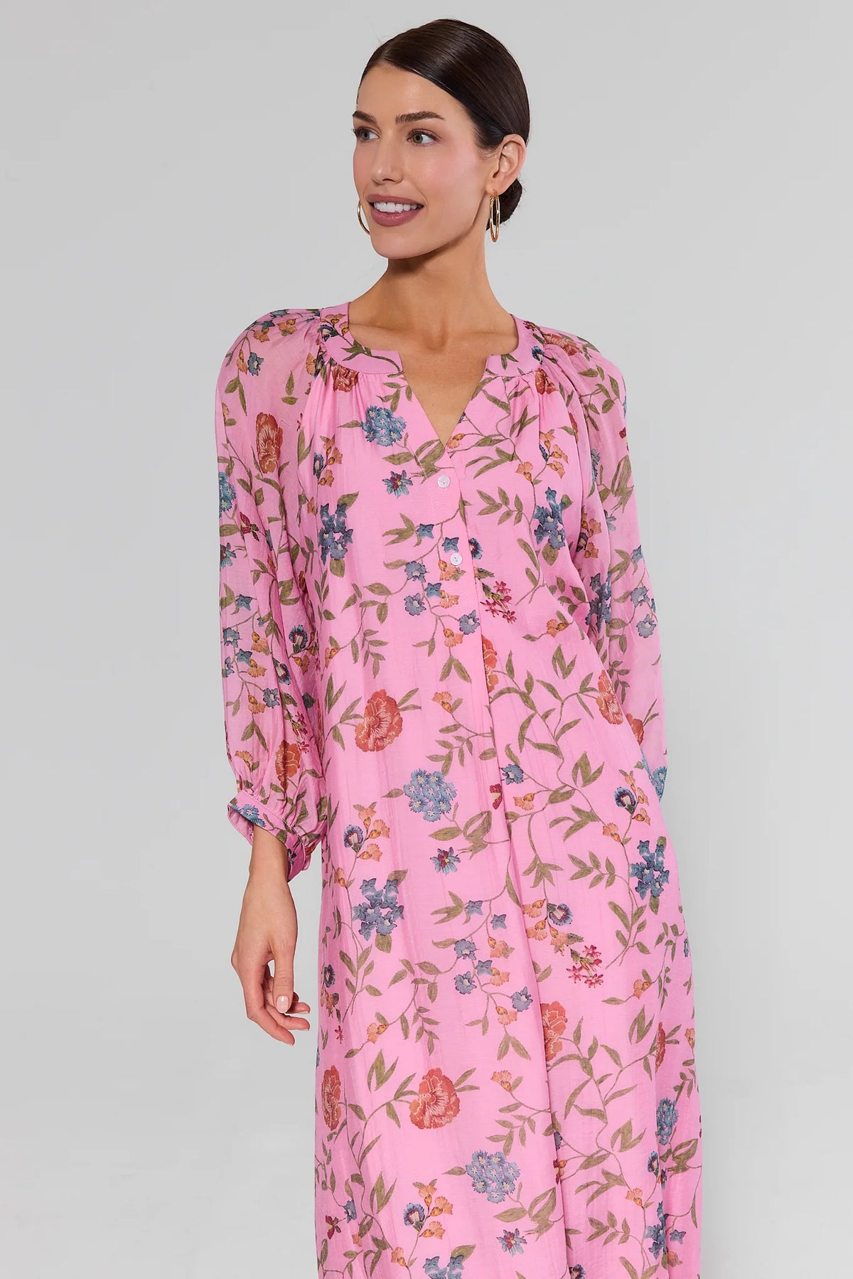 Gracen pink floral maxi dress side angle, modest long sleeves and flowy silhouette | Avara