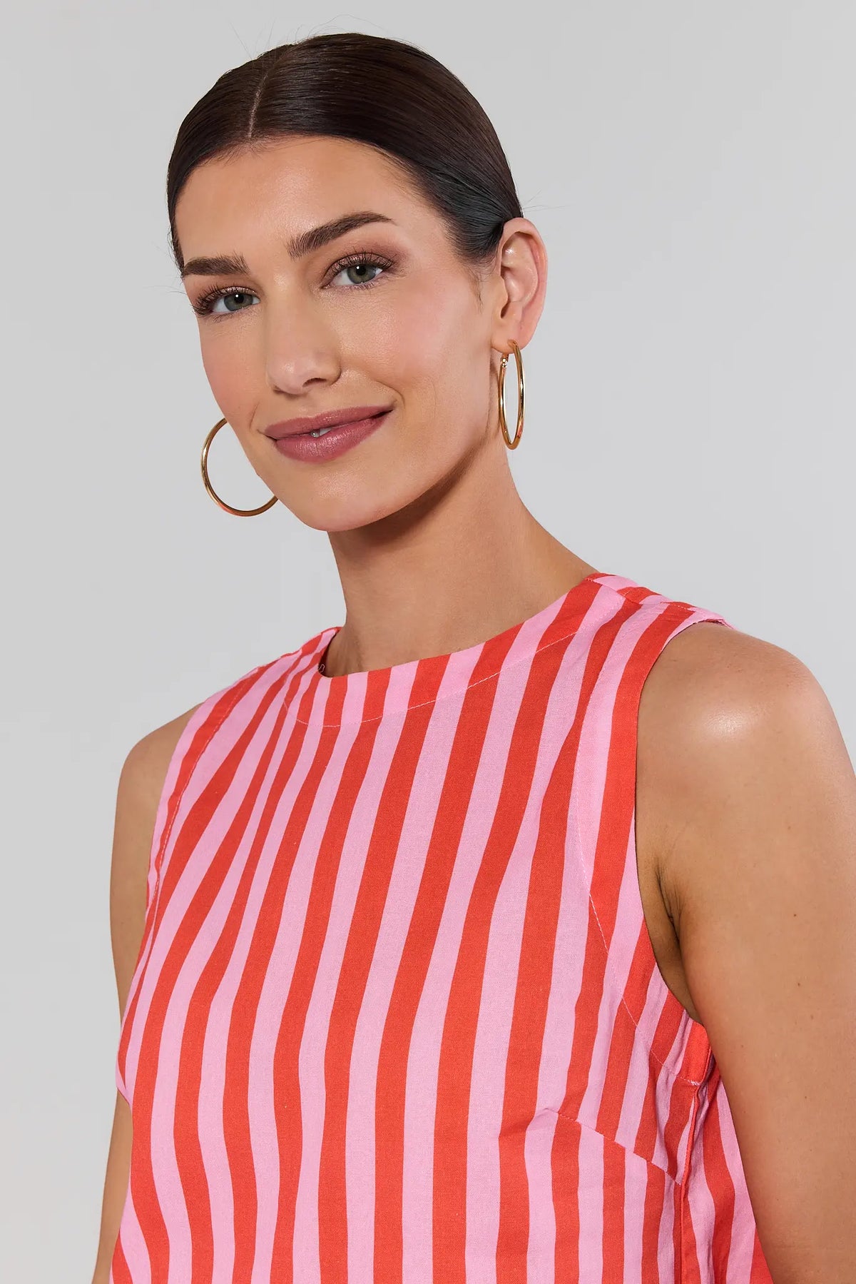 Close-up of orange striped Blaire Top, round neckline and cropped silhouette detail | Avara