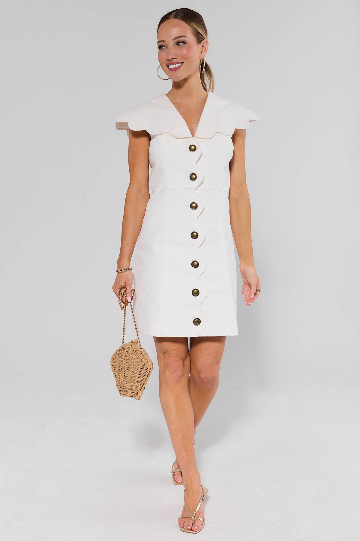 White scalloped collar short dress styled with strappy sandals and woven bag, full-length front view | Avara