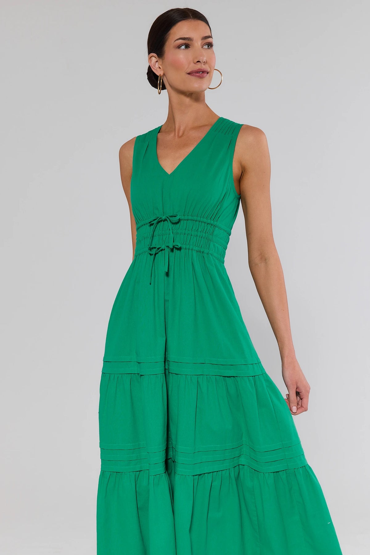 Green tiered maxi dress with V-neckline and drawstring waist - Front Angle On Model | Avara