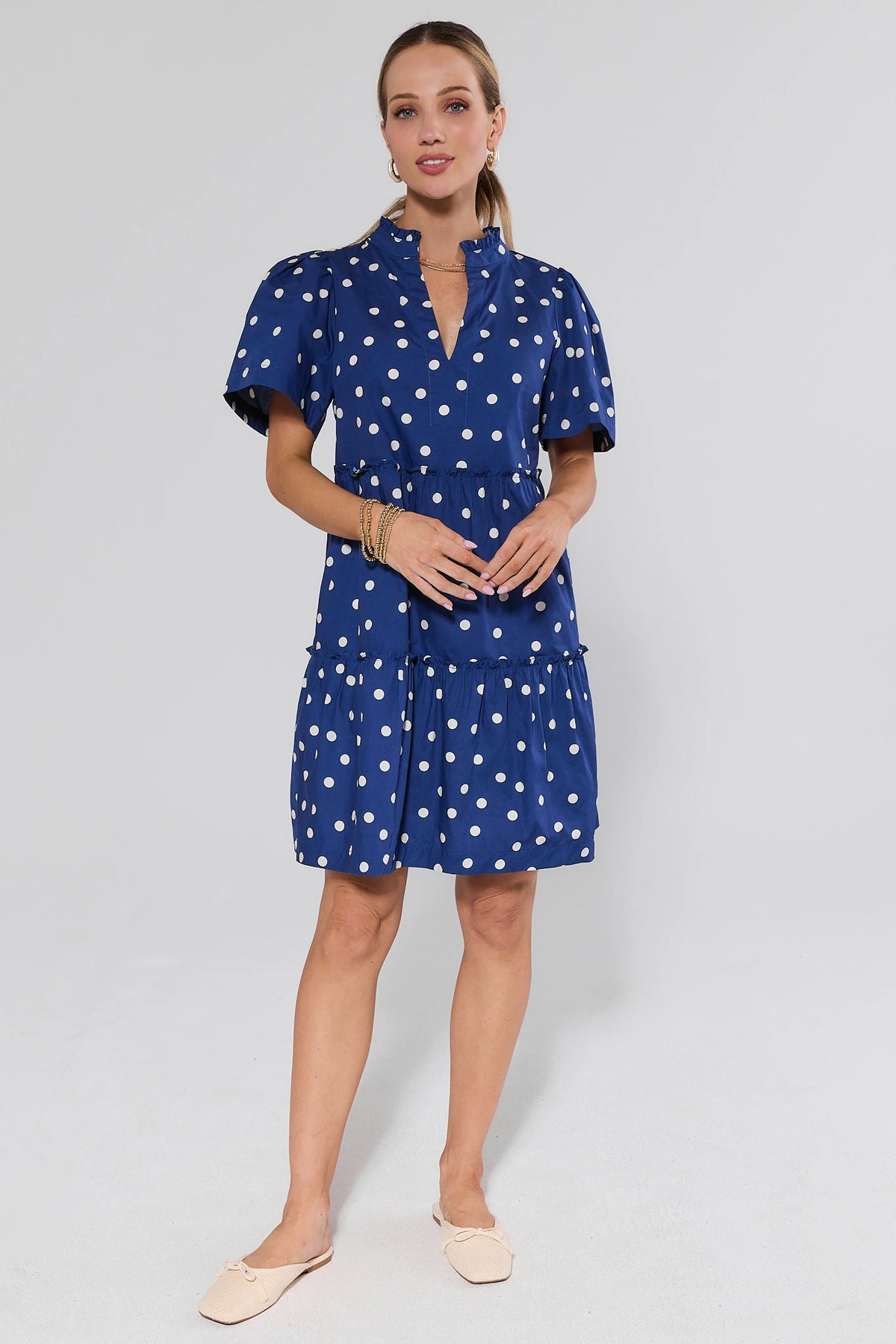 Evan Navy Polka Dot Short Dress - full-length front view, navy polka dot women's dress styled with flats | Avara